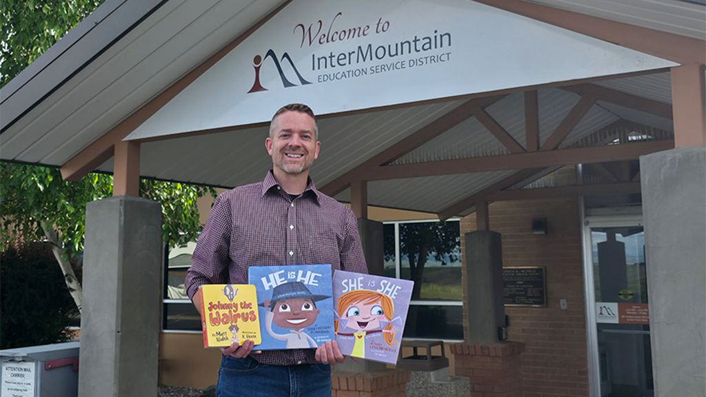 Rod Theis shows his books Johnny the Walrus, He is He and She is She.