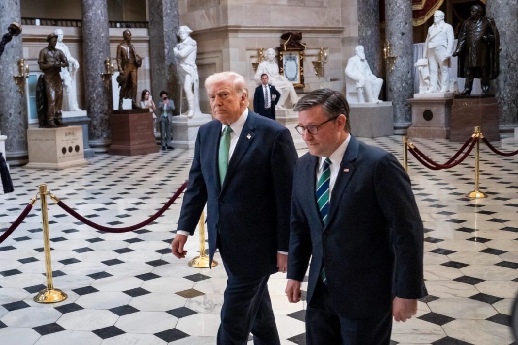 President Donald Trump and House Speaker Mike Johnson walk in the U.S. Capitol building in Washington on March 17, 2026.