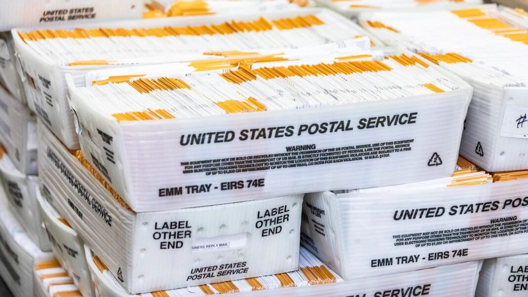 Voting ballots move forward in the audit process at the Orange County Registrars office in Santa Ana, Calif., on June 9, 2022
