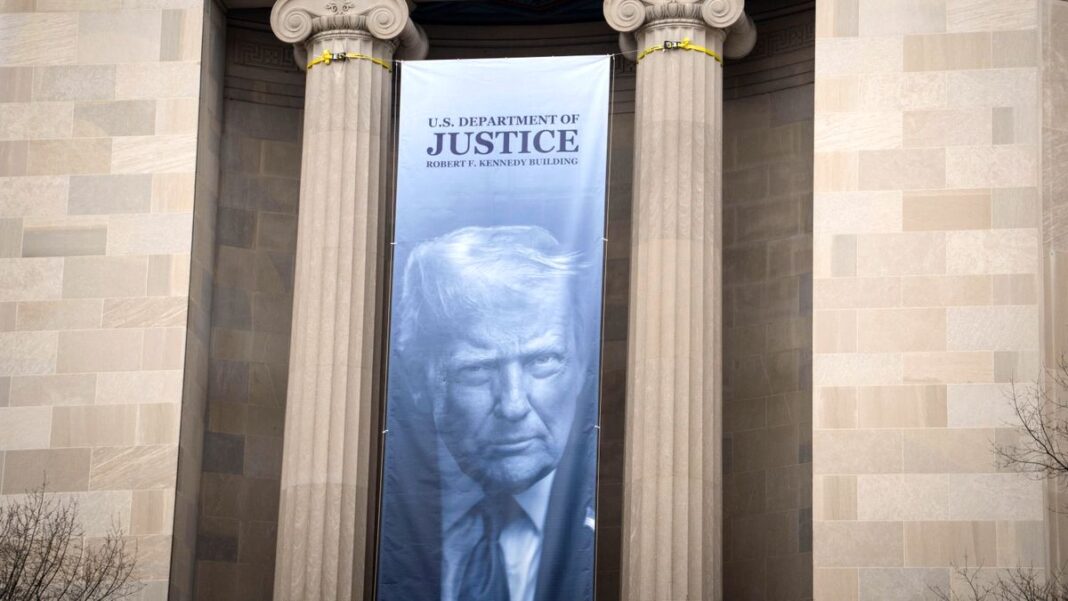 A banner showing President Donald Trump at the DOJ.